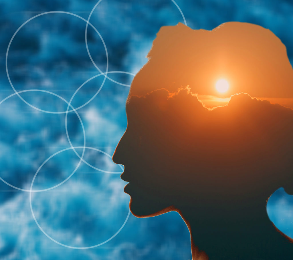 Woman with sun over clouds in her head. Mental health concept